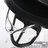 A close-up view of the filter and lid of a glass electric kettle. Voir les images du produit