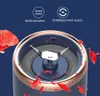 Close-up of a portable blender with red fruit pieces flying around it, against a dark blue background with feature callouts. Podgląd zdjęcia produktu