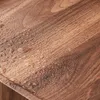 A close-up shot of a wooden surface with water droplets. Produktbild-Vorschau