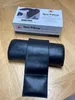 A black spa pillow is shown on a wooden surface, with its packaging box in the background. Produktbild-Vorschau