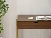 A close-up view of a wooden desk with a drawer, a smartphone, and an open magazine on top. Anteprima dell’immagine prodotto