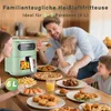 A family is enjoying a meal together, with an air fryer prominently displayed on the table. Podgląd zdjęcia produktu