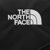 A close-up of the North Face logo embroidered on a black fabric. Voir les images du produit