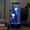 A jellyfish lamp is placed on a table next to some books, with a couch in the background. Anteprima dell’immagine prodotto