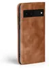 A brown flip cover case for a Google Pixel 6a phone is shown against a white background. Produktbild-Vorschau