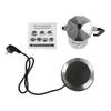 A flat lay of an espresso maker set with an instruction manual and a separate electric heating plate. Produktbild-Vorschau