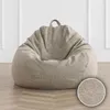 A light gray bean bag chair is shown on a light wood floor against a white wall with molding. Produktbild-Vorschau