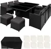A black rattan outdoor furniture set with a glass-topped table, chairs, and ottomans, along with a black cover and white cushions. Náhled obrázku produktu