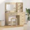 A vanity table with a mirror and shelves, along with a stool, is set up in a room. Náhled obrázku produktu
