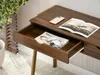 A close-up view of a wooden desk with an open drawer. Anteprima dell’immagine prodotto