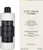 A bottle of Sisley hair shampoo and its packaging are shown against a white background. Anteprima dell’immagine prodotto