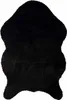 A black sheepskin rug is shown from a top-down perspective on a white background. Produktbild-Vorschau