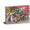 A puzzle box depicting a flower market scene with people and a horse-drawn carriage. Podgląd zdjęcia produktu