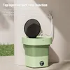 A portable washing machine with a water hose connected to a faucet. Náhled obrázku produktu