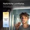 A man is brushing his teeth in front of a mirror, with a graphic overlay showing different light color temperatures. Anteprima dell’immagine prodotto