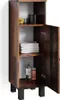 A tall, narrow wooden cabinet with an open door, showing shelves with towels, soap, and decorative items. Náhled obrázku produktu