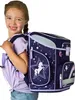 A young girl is wearing a backpack. Produktbild-Vorschau