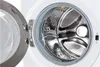 Close-up of the inside of a front-loading washing machine with the door open. Náhľad obrázku produktu