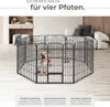 A dog pen set up indoors with a dog inside. Produktbild-Vorschau