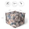 A cube-shaped pouf with a tropical leaf and flower pattern, shown with dimensions and feature icons. Produktbild-Vorschau