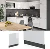 A modern kitchen with white high-gloss cabinets and a dark marble backsplash, featuring a dining table in the foreground. Below is a close-up of a white panel with an anthracite base. Anteprima dell’immagine prodotto