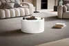 Runder Couchtisch Monobloc in Weiß Hochglanz mit glatter, zylindrischer Form in Wohnzimmer-Gesamtansicht. Produktbild-Vorschau