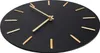 A close-up, angled view of a black wall clock with gold hour markers and hands, set against a white background. Voir les images du produit