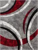 A close-up, top-down view of a rug with an abstract geometric pattern. Produktbild-Vorschau