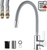 A kitchen faucet with flexible hose and accessories, presented on a white background. Produktbild-Vorschau