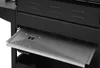 A close-up view of a metal drip tray pulled out from a gas grill. Produktbild-Vorschau
