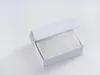 A white gift box with the lid open, revealing a white silk pillowcase inside. Podgląd zdjęcia produktu