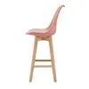 A side view of a pink bar stool with a wooden frame against a white background. Náhled obrázku produktu
