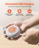 Hands holding a small, round, white device and plugging in a USB cable. Produktbild-Vorschau