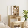 A dressing table with a mirror and shelves filled with cosmetics, placed in a room with a bed and a plant. Voir les images du produit