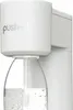 A close-up of a white soda maker with a clear bottle filled with water. Podgląd zdjęcia produktu