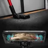 Close-up of a vacuum cleaner head on a carpeted floor, with an internal view highlighting the cleaning mechanism. Voir les images du produit