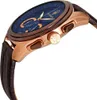 A close-up side view of a men's chronograph watch with a blue dial and rose gold casing. Produktbild-Vorschau