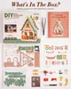 A flat lay of a DIY miniature Christmas house kit, showing the box, instruction booklet, and all the unassembled parts. Produktbild-Vorschau