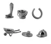 A collection of six silver-colored game tokens, including a boot, bucket, horseshoe, wheelbarrow, brush, and helmet, arranged in two rows on a white background. Produktbild-Vorschau