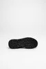 The sole of a black shoe is shown against a white background. Anteprima dell’immagine prodotto