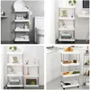 Collage of four images showcasing slim rolling storage carts in different settings, including a bathroom, near a desk, and in a kitchen. Náhled obrázku produktu