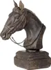 A dark brown resin sculpture of a horse head on a square base, with a black chain around its neck. Produktbild-Vorschau