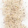 A close-up overhead view of a pile of sand on a white background. Produktbild-Vorschau
