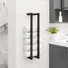 A black towel rack with rolled towels is mounted on a white tiled wall in a bathroom, next to a sink and vanity. Anteprima dell’immagine prodotto