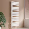A white designer radiator is shown in a bathroom setting next to a large plant. Podgląd zdjęcia produktu