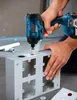 A person is using a Bosch impact driver to drill a hole in a metal electrical box. Anteprima dell’immagine prodotto