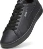 A close-up studio shot of a black Puma sneaker. Produktbild-Vorschau