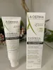 A product shot of a skincare product and its box, with some blurred foliage in the background. Náhľad obrázku produktu