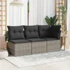 A three-seater outdoor sofa with dark gray cushions is placed on a patio with a rug underneath. White curtains and wooden trellises are in the background, along with some greenery. Produktbild-Vorschau