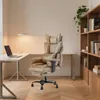 A modern home office setup with a desk, laptop, lamp, and a bookshelf. Voir les images du produit